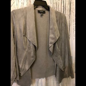 Dressy light jacket with zipper design on sides.